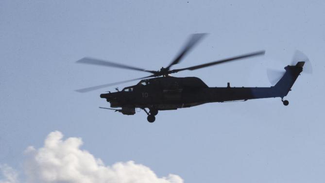 Russian Army&#39;s MI-28 helicopter flies during the Army-2015 show at a shooting range in Alabino, outside of Moscow, Russia, on Tuesday, June 16, 2015. Russia’s military this year alone will receive over 40 new intercontinental ballistic missiles capable of piercing any missile defences, President Vladimir Putin said Tuesday in a blunt reminder of the nation’s nuclear might amid tensions with the West over Ukraine. (AP Photo/Ivan Sekretarev)